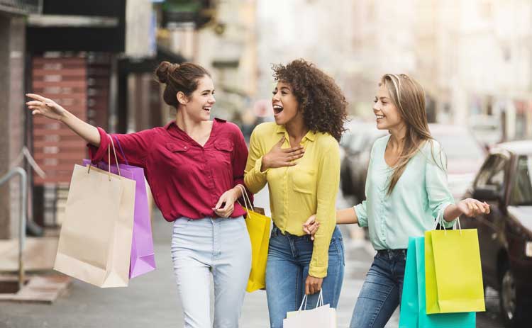 happy shoppers with shopping bags